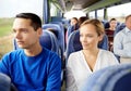 Happy couple or passengers in travel bus Royalty Free Stock Photo