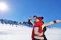 Happy couple playful together during winter holidays vacation outside in snow park Royalty Free Stock Photo