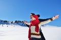 Happy couple playful together during winter holidays vacation outside in snow park Royalty Free Stock Photo