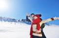 Happy couple playful together during winter holidays vacation outside in snow park Royalty Free Stock Photo