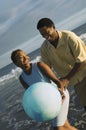 Happy Couple Playing With Beach Ball Royalty Free Stock Photo