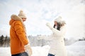 Happy couple playing with snow in winter Royalty Free Stock Photo