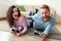 Happy couple playing video games at home Royalty Free Stock Photo