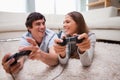 Happy couple playing video games together Royalty Free Stock Photo