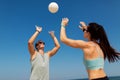 Happy couple playing volleyball on summer beach Royalty Free Stock Photo