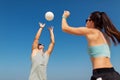 Happy couple playing volleyball on summer beach Royalty Free Stock Photo