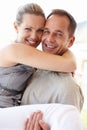 Happy couple, portrait and carry with love, excited and bonding at home or holiday and vacation for honeymoon. Man and