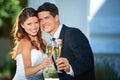 Happy couple, portrait and champagne cheers at wedding for outdoor marriage celebration, love or commitment. Married man