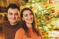 Happy Couple Portrait And Christmas Tree Royalty Free Stock Photo