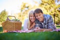 Happy couple, portrait and smile at park picnic or fruit basket for holiday snack for relationship, travel or relax. Man Royalty Free Stock Photo