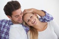 Happy couple, portrait and touch with embrace, marriage and relaxing for love, home and couch. Wife, husband and smile Royalty Free Stock Photo