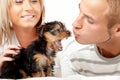 Happy couple with a puppy Royalty Free Stock Photo