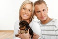 Happy couple with a puppy Royalty Free Stock Photo