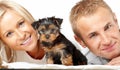 Happy couple with a puppy Royalty Free Stock Photo