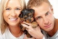 Happy couple with a puppy Royalty Free Stock Photo