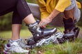 Happy couple putting on roller blades Royalty Free Stock Photo