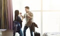 Happy couple arriving in hotel room on holidays Royalty Free Stock Photo