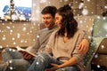 Happy couple reading book at home Royalty Free Stock Photo