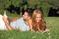 Happy couple reading books outdoor Royalty Free Stock Photo