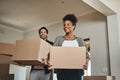 Happy couple, real estate and moving in with boxes for renovation, investment or relocation in new home. Interracial man Royalty Free Stock Photo