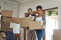 Happy couple, real estate and moving in property with boxes for renovation, investment or relocation. Excited Royalty Free Stock Photo