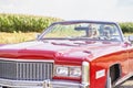 Smiling couple in a red old car Royalty Free Stock Photo
