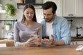 Happy couple relax at home using smartphones Royalty Free Stock Photo