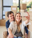 Happy couple, relax and moving in with selfie for photography, new home or picture at apartment. Young man and woman Royalty Free Stock Photo
