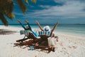 Happy couple relax on a tropical beach Royalty Free Stock Photo