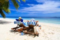 Happy couple relax on a tropical beach Royalty Free Stock Photo