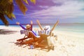 Happy couple relax on a tropical beach Royalty Free Stock Photo