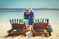 Happy couple relax on a tropical beach Royalty Free Stock Photo