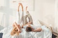 happy couple relaxing in bed and holding hands Royalty Free Stock Photo