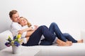 Happy couple relaxing on couch Royalty Free Stock Photo