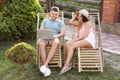 Happy couple relaxing in deckchairs Royalty Free Stock Photo