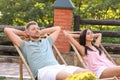 Happy couple relaxing in deckchairs Royalty Free Stock Photo