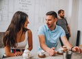 Happy couple relaxing drinking coffee in a cafe looking away