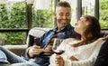 Happy couple relaxing with a glass of wine Royalty Free Stock Photo