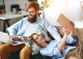 Happy couple relaxing at home with laptop and tablet Royalty Free Stock Photo