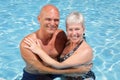 Happy couple relaxing by the pool Royalty Free Stock Photo