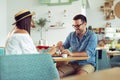 Happy couple at restaurant eating lunch, having fun Royalty Free Stock Photo