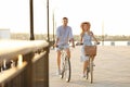 Happy couple riding bicycles outdoors Royalty Free Stock Photo