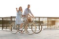 Happy couple riding bicycles outdoors Royalty Free Stock Photo