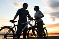 Happy couple riding bicycles outside, healthy life Royalty Free Stock Photo