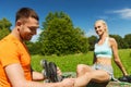 Happy couple with rollerblades outdoors Royalty Free Stock Photo