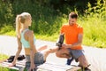 Happy couple with rollerblades outdoors Royalty Free Stock Photo