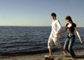Happy couple running on beach Royalty Free Stock Photo