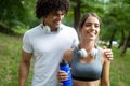 Happy couple running and jogging together outdoor Royalty Free Stock Photo