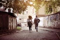 Happy couple running outdoor. Young couple running on the street Royalty Free Stock Photo