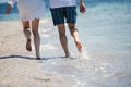 happy couple running on the sea beach Royalty Free Stock Photo